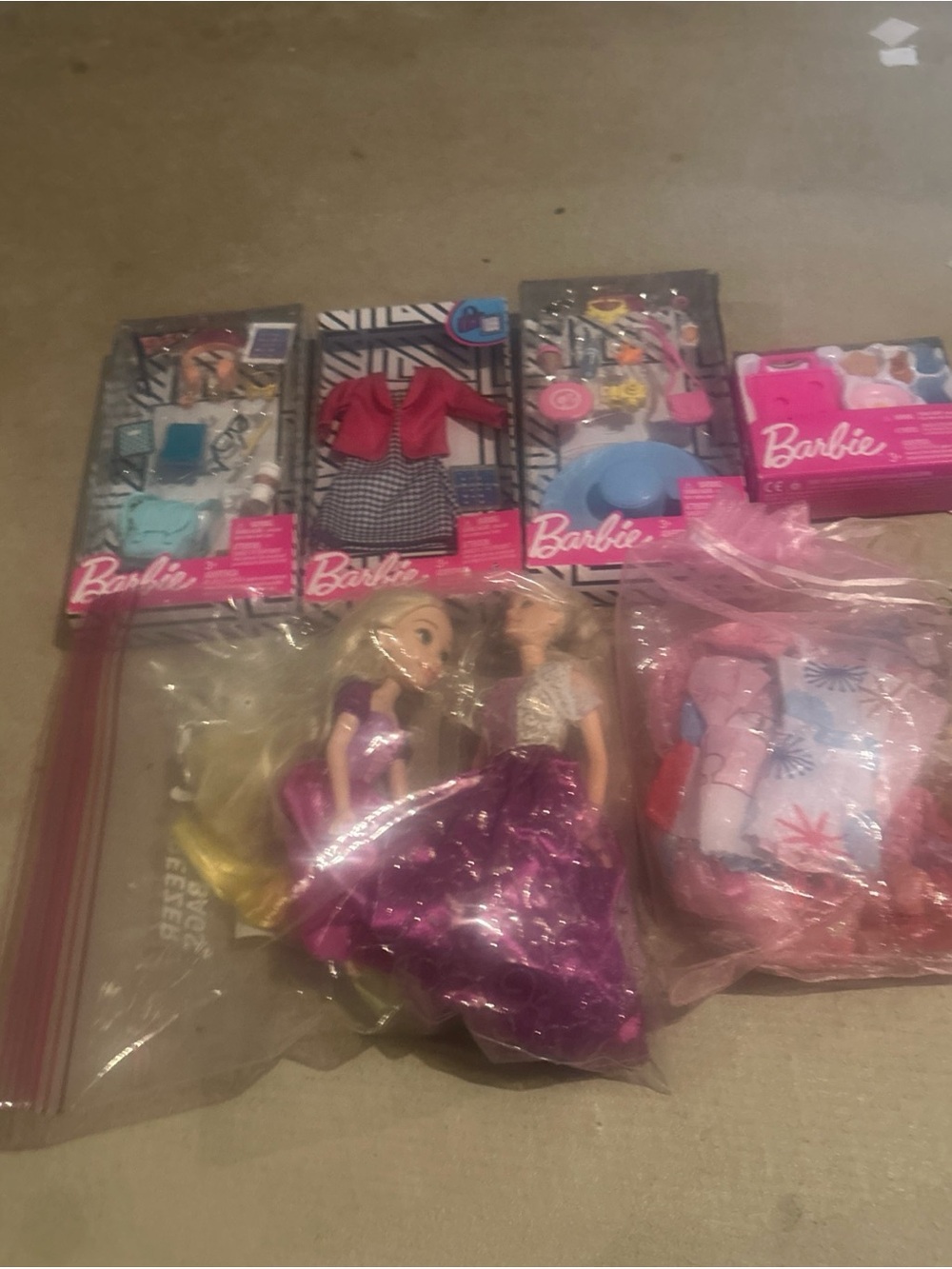 Huge lot of Barbie items includes many new unopened packages